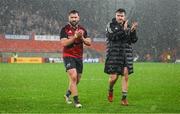 20 January 2024; Eoghan Clarke, left, and Niall Scannell of Munster leave the pitch after the Investec Champions Cup Pool 3 Round 4 match between Munster and Northampton Saints at Thomond Park in Limerick. Photo by Brendan Moran/Sportsfile
