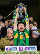 21 January 2024; Tiarnan Flanagan of Glen lifts the Andy Merrigan Cup after his side's victory in the AIB GAA Football All-Ireland Senior Club Championship Final match between Glen of Derry and St Brigid's of Roscommon at Croke Park in Dublin. Photo by Ramsey Cardy/Sportsfile