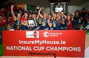 21 January 2024; Gurranabraher Credit Union Brunell players celebrate with the trophy after their side's victory in the Basketball Ireland Paudie O'Connor Cup Final match between Catalyst Fr Mathews and Gurranabraher Credit Union Brunell at the National Basketball Arena in Tallaght, Dublin. Photo by Seb Daly/Sportsfile