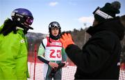22 January 2024; Finlay Wilson of Team Ireland with teammate Eábha McKenna and coach Giorgio Marchesini after the mens Alpine Combined Slalom event during day three of the Winter Youth Olympic Games 2024 at Gangwon in South Korea. Photo by Eóin Noonan/Sportsfile
