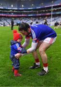 21 January 2024; St Thomas' goalkeeper Gerald Kelly with his daughter Éada after his side's victory in the AIB GAA Hurling All-Ireland Senior Club Championship Final match between O’Loughlin Gaels of Kilkenny and St. Thomas’ of Galway at Croke Park in Dublin. Photo by Piaras Ó Mídheach/Sportsfile
