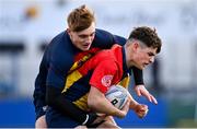 23 January 2024; Oisin Kelly of St Fintan's is tackled by Matthew O'Callaghan Albiati of Temple Carrig during the Bank of Ireland Leinster Rugby Schools Vinnie Murray Cup semi-final match between Temple Carrig School and St Fintan’s High School at Energia Park in Dublin. Photo by Tyler Miller/Sportsfile