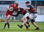 23 January 2024; Jude Barrett of CUS in action against Elliot Walsh, centre, and Samuel Neely of The High School during the Bank of Ireland Leinster Rugby Schools Vinnie Murray Cup semi-final match between High School and CUS at Energia Park in Dublin. Photo by Tyler Miller/Sportsfile