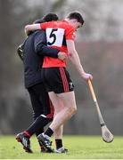 24 January 2024; Robert Downey of UCC leaves the pitch, with the assistance of UCC coach Seán Óg Ó hAilpín, as he is substituted due to injury during the Electric Ireland Higher Education GAA Fitzgibbon Cup Round 2 match between Mary Immaculate College Limerick and UCC at MICL Grounds in Limerick. Photo by Piaras Ó Mídheach/Sportsfile