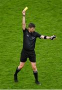 21 January 2024; Referee Seán Stack brandishes a yellow card during the AIB GAA Hurling All-Ireland Senior Club Championship Final match between O’Loughlin Gaels of Kilkenny and St. Thomas’ of Galway at Croke Park in Dublin. Photo by Sam Barnes/Sportsfile