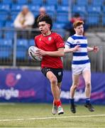 25 January 2024; Mark Murray of CUS on his way to scoring his side's third try during the Bank of Ireland Leinster Rugby Schools Father Godfrey Cup semi-final match between Good Counsel, New Ross and CUS at Energia Park in Dublin. Photo by Ben McShane/Sportsfile