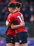 25 January 2024; Mark Murray of CUS celebrates with teammate David Li, 12, after scoring their side's third try during the Bank of Ireland Leinster Rugby Schools Father Godfrey Cup semi-final match between Good Counsel, New Ross and CUS at Energia Park in Dublin. Photo by Ben McShane/Sportsfile