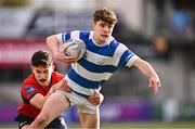 25 January 2024; Lee Whitty of Good Counsel, New Ross, is tackled by David Li of CUS during the Bank of Ireland Leinster Rugby Schools Father Godfrey Cup semi-final match between Good Counsel, New Ross and CUS at Energia Park in Dublin. Photo by Ben McShane/Sportsfile