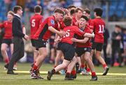25 January 2024; CUS players, from left, Peter Smyth, Christian Shortall and Aiden McLoughlin celebrate after the Bank of Ireland Leinster Rugby Schools Father Godfrey Cup semi-final match between Good Counsel, New Ross and CUS at Energia Park in Dublin. Photo by Ben McShane/Sportsfile