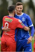 27 January 2024; Kacper Radkowski of Waterford and John O'Sullivan of Shelbourne after the pre-season friendly match between Shelbourne and Waterford at AUL Complex in Clonsaugh, Dublin. Photo by Seb Daly/Sportsfile