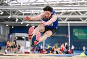 27 January 2024; Luke O'Carroll of Tralee Harriers AC, Kerry, competes in the men's long jump during day one of the AAI Games & 123.ie National Indoor Combined Events at the National Indoor Arena in Dublin. Photo by Sam Barnes/Sportsfile