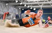 27 January 2024; Joseph Miniter of Nenagh Olympic AC, Tipperary, competes in the men's long jump during day one of the AAI Games & 123.ie National Indoor Combined Events at the National Indoor Arena in Dublin. Photo by Sam Barnes/Sportsfile