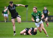 27 January 2024; Shane Walsh of Meath evades the tackle of Joe McDade, left, and Lee Cullen of Fermanagh during the Allianz Football League Division 2 match between Meath and Fermanagh at Páirc Tailteann in Navan, Meath. Photo by Tyler Miller/Sportsfile