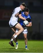27 January 2024; Dara McVeety of Cavan in action against Kevin O'Callaghan of Kildare during the Allianz Football League Division 2 match between Kildare and Cavan at Netwatch Cullen Park in Carlow. Photo by David Fitzgerald/Sportsfile