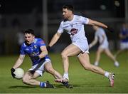 27 January 2024; Niall Carolan of Cavan is fouled by Ben McCormack of Kildare during the Allianz Football League Division 2 match between Kildare and Cavan at Netwatch Cullen Park in Carlow. Photo by Stephen Marken/Sportsfile