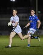 27 January 2024; Brian Byrne of Kildare in action against Dara McVeety of Cavan during the Allianz Football League Division 2 match between Kildare and Cavan at Netwatch Cullen Park in Carlow. Photo by Stephen Marken/Sportsfile