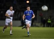 27 January 2024; Dara McVeety of Cavan in action against Mick O'Grady of Kildare during the Allianz Football League Division 2 match between Kildare and Cavan at Netwatch Cullen Park in Carlow. Photo by Stephen Marken/Sportsfile