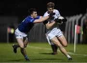 27 January 2024; Kevin O'Callaghan of Kildare in action against Niall Carolan of Cavan during the Allianz Football League Division 2 match between Kildare and Cavan at Netwatch Cullen Park in Carlow. Photo by David Fitzgerald/Sportsfile