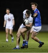 27 January 2024; Darragh Kirwan of Kildare in action against Jason McLoughlin of Cavan during the Allianz Football League Division 2 match between Kildare and Cavan at Netwatch Cullen Park in Carlow. Photo by David Fitzgerald/Sportsfile