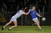 27 January 2024; Paddy Woodgate of Kildare in action against Oisin Kiernan of Cavan during the Allianz Football League Division 2 match between Kildare and Cavan at Netwatch Cullen Park in Carlow. Photo by Stephen Marken/Sportsfile