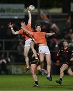 27 January 2024; Ciaran Mackin of Armagh, left, wins possession of a high ball against Armagh teammate Ben Crealey and Tommy Durnin of Louth during the Allianz Football League Division 2 match between Armagh and Louth at BOX-IT Athletic Grounds in Armagh. Photo by Ben McShane/Sportsfile