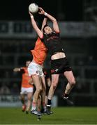 27 January 2024; Tommy Durnin of Louth in action against Ben Crealey of Armagh during the Allianz Football League Division 2 match between Armagh and Louth at BOX-IT Athletic Grounds in Armagh. Photo by Ben McShane/Sportsfile
