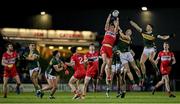 27 January 2024; Shane McGuigan of Derry catches a kickout ahead of Jason Foley and Diarmuid O'Connor of Kerry during the Allianz Football League Division 1 match between Kerry and Derry at Austin Stack Park in Tralee, Kerry. Photo by Brendan Moran/Sportsfile