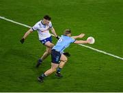 27 January 2024; Ciaran McNulty of Monaghan shoots past Cian Murphy of Dublin to score what proved to be the winning point, in the 74th minute, during the Allianz Football League Division 1 match between Dublin and Monaghan at Croke Park in Dublin. Photo by Ray McManus/Sportsfile