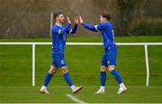 27 January 2024; Pádraig Amond of Waterford, left, celebrates with teammate Kacper Skwierczynski after scoring their side's first goal during the pre-season friendly match between Shelbourne and Waterford at AUL Complex in Clonsaugh, Dublin. Photo by Seb Daly/Sportsfile