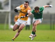 28 January 2024; Dermot McAleese of Antrim is tackled by Brian O'Sullivan of Limerick during the Allianz Football League Division 3 match between Limerick and Antrim at Mick Neville Park in Rathkeale, Limerick. Photo by Tom Beary/Sportsfile