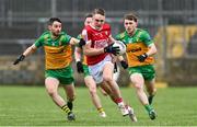 28 January 2024; Tommy Walsh of Cork in action against Ryan McHugh of Donegal during the Allianz Football League Division 2 match between Donegal and Cork at MacCumhaill Park in Ballybofey, Donegal. Photo by Ramsey Cardy/Sportsfile