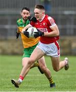 28 January 2024; Tommy Walsh of Cork in action against Ryan McHugh of Donegal during the Allianz Football League Division 2 match between Donegal and Cork at MacCumhaill Park in Ballybofey, Donegal. Photo by Ramsey Cardy/Sportsfile
