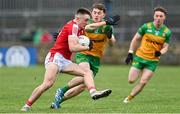 28 January 2024; Tommy Walsh of Cork in action against Shane O'Donnell of Donegal during the Allianz Football League Division 2 match between Donegal and Cork at MacCumhaill Park in Ballybofey, Donegal. Photo by Ramsey Cardy/Sportsfile