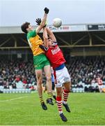 28 January 2024; Domhnall Mac Giolla Bhride of Donegal in action against Ian Maguire of Cork during the Allianz Football League Division 2 match between Donegal and Cork at MacCumhaill Park in Ballybofey, Donegal. Photo by Ramsey Cardy/Sportsfile