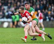 28 January 2024; Matty Taylor of Cork in action against Patrick McBrearty of Donegal during the Allianz Football League Division 2 match between Donegal and Cork at MacCumhaill Park in Ballybofey, Donegal. Photo by Ramsey Cardy/Sportsfile