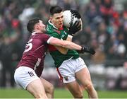 28 January 2024; Fergal Boland of Mayo in action against Cathal Sweeney of Galway during the Allianz Football League Division 1 match between Galway and Mayo at Pearse Stadium in Galway. Photo by Piaras Ó Mídheach/Sportsfile