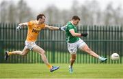 28 January 2024; Cillian Fahy of Limerick has a shot on goal despite pressure from Eoin Hynds of Antrim during the Allianz Football League Division 3 match between Limerick and Antrim at Mick Neville Park in Rathkeale, Limerick. Photo by Tom Beary/Sportsfile
