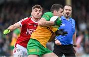28 January 2024; Caolan McGonagle of Donegal in action against Ian Maguire of Cork during the Allianz Football League Division 2 match between Donegal and Cork at MacCumhaill Park in Ballybofey, Donegal. Photo by Ramsey Cardy/Sportsfile