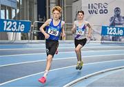 28 January 2024; Rian McCaffrey of Longford AC, left, and Conn McCluskey of Dundrum South Dublin AC, compete in the 800m of the under 15 boys combined events during day two of 123.ie National Indoor Combined Events at the Sport Ireland National Indoor Arena in Dublin. Photo by Sam Barnes/Sportsfile