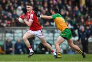 28 January 2024; David Buckley of Cork in action against Ryan McHugh of Donegal during the Allianz Football League Division 2 match between Donegal and Cork at MacCumhaill Park in Ballybofey, Donegal. Photo by Ramsey Cardy/Sportsfile