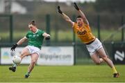 28 January 2024; Peter Nash of Limerick in action against Patrick McAleer of Antrim during the Allianz Football League Division 3 match between Limerick and Antrim at Mick Neville Park in Rathkeale, Limerick. Photo by Tom Beary/Sportsfile