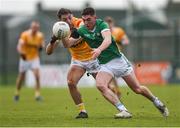 28 January 2024; Paul Maher of Limerick is tackled by Niall Burns of Antrim during the Allianz Football League Division 3 match between Limerick and Antrim at Mick Neville Park in Rathkeale, Limerick. Photo by Tom Beary/Sportsfile