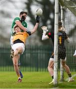 28 January 2024; Eunan Walsh of Antrim in action against Tommy Childs of Limerick during the Allianz Football League Division 3 match between Limerick and Antrim at Mick Neville Park in Rathkeale, Limerick. Photo by Tom Beary/Sportsfile