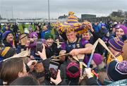28 January 2024; Wexford captain Lee Chin signs autographs after the Dioralyte Walsh Cup Final match between Wexford and Galway at Netwatch Cullen Park in Carlow. Photo by Seb Daly/Sportsfile