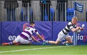 28 January 2024; Gordon Barr of Belvedere College dives over to score his side's third try despite the efforts of Gavin Keane of Clongowes Wood College during the Bank of Ireland Leinster Schools Senior Cup First Round match between Clongowes Wood College and Belvedere College at Energia Park in Dublin. Photo by Tyler Miller/Sportsfile