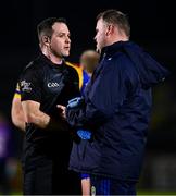 28 January 2024; Roscommon manager Davy Burke in conversation with referee Martin McNally after the Allianz Football League Division 1 match between Tyrone and Roscommon at O’Neills Healy Park in Omagh, Tyrone. Photo by Ben McShane/Sportsfile