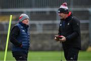 28 January 2024; Cork manager John Cleary, left, and Cork selector Kevin Walsh before the Allianz Football League Division 2 match between Donegal and Cork at MacCumhaill Park in Ballybofey, Donegal. Photo by Ramsey Cardy/Sportsfile