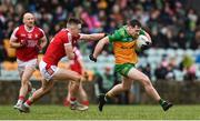 28 January 2024; Jamie Brennan of Donegal in action against Tommy Walsh of Cork during the Allianz Football League Division 2 match between Donegal and Cork at MacCumhaill Park in Ballybofey, Donegal. Photo by Ramsey Cardy/Sportsfile
