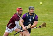 28 January 2024; Lee Chin of Wexford in action against Ronan Glennon of Galway during the Dioralyte Walsh Cup Final match between Wexford and Galway at Netwatch Cullen Park in Carlow. Photo by Seb Daly/Sportsfile