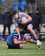29 January 2024; Frazer McKenna of St Michael's College is tackled by John Cadogan of St Vincent's Castleknock College during the Bank of Ireland Leinster Schools Senior Cup first round match between St Michael's College and St Vincent's Castleknock College at Energia Park in Dublin. Photo by Piaras Ó Mídheach/Sportsfile